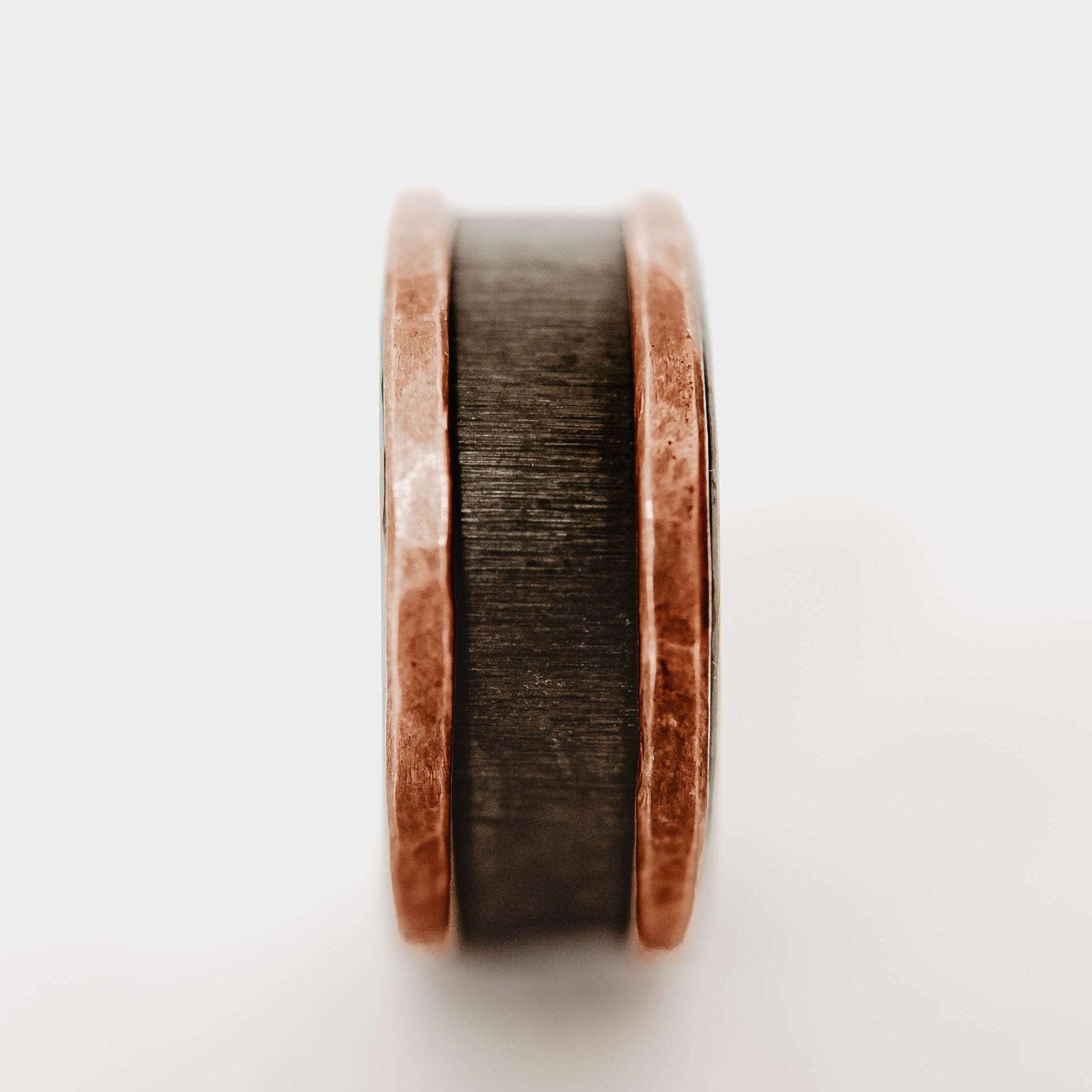 Mens zirconium and copper wedding band. This photo shows a vertical grit zirconium band with a copper band on each edge. (Vertical with white background)