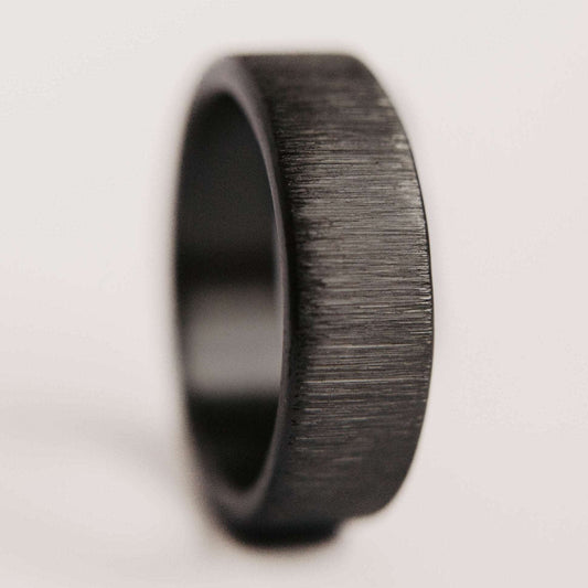 Vertical Grit Zirconium Mens Wedding band. This photo shows a vertical grit zirconium band. (Vertical with white background)