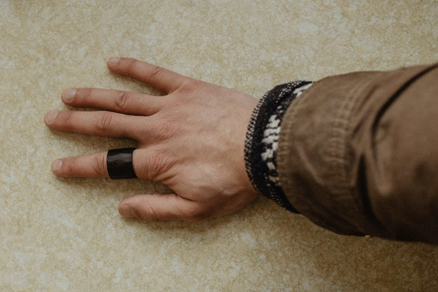 African Blackwood Ring, Dark lightly faceted wide wood ring. (Shown on hand)