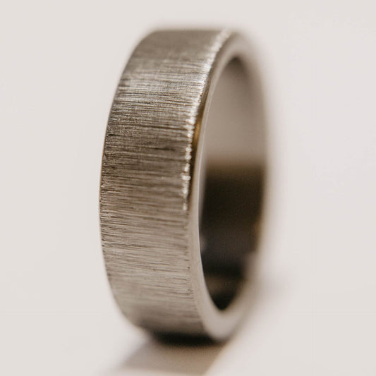 Vertical Grain Titanium wedding band. This photo shows a vertical grain gray titanium ring. (Vertical with white background)