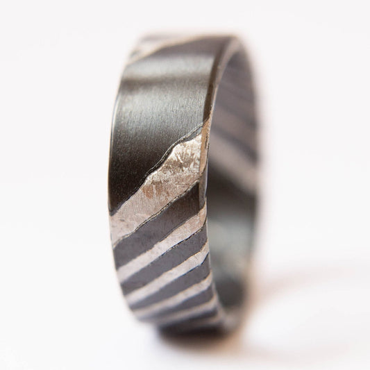 Black Zirconium and Crystallized Titanium Damascus Wedding Band. Black and Silver Ring. (Vertical with white background)