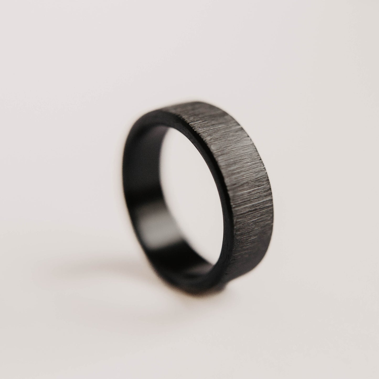 Vertical Grit Zirconium Mens Wedding band. This photo shows a vertical grit zirconium band. (Vertical with white background)