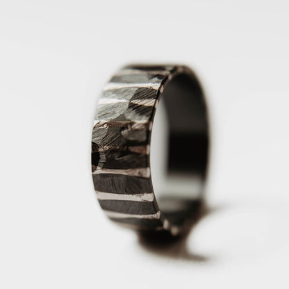 Moonlight Silver Wedding Band. This photo shows a roughly faceted zirconium wedding band with sterling silver stripes (Vertical with white background)