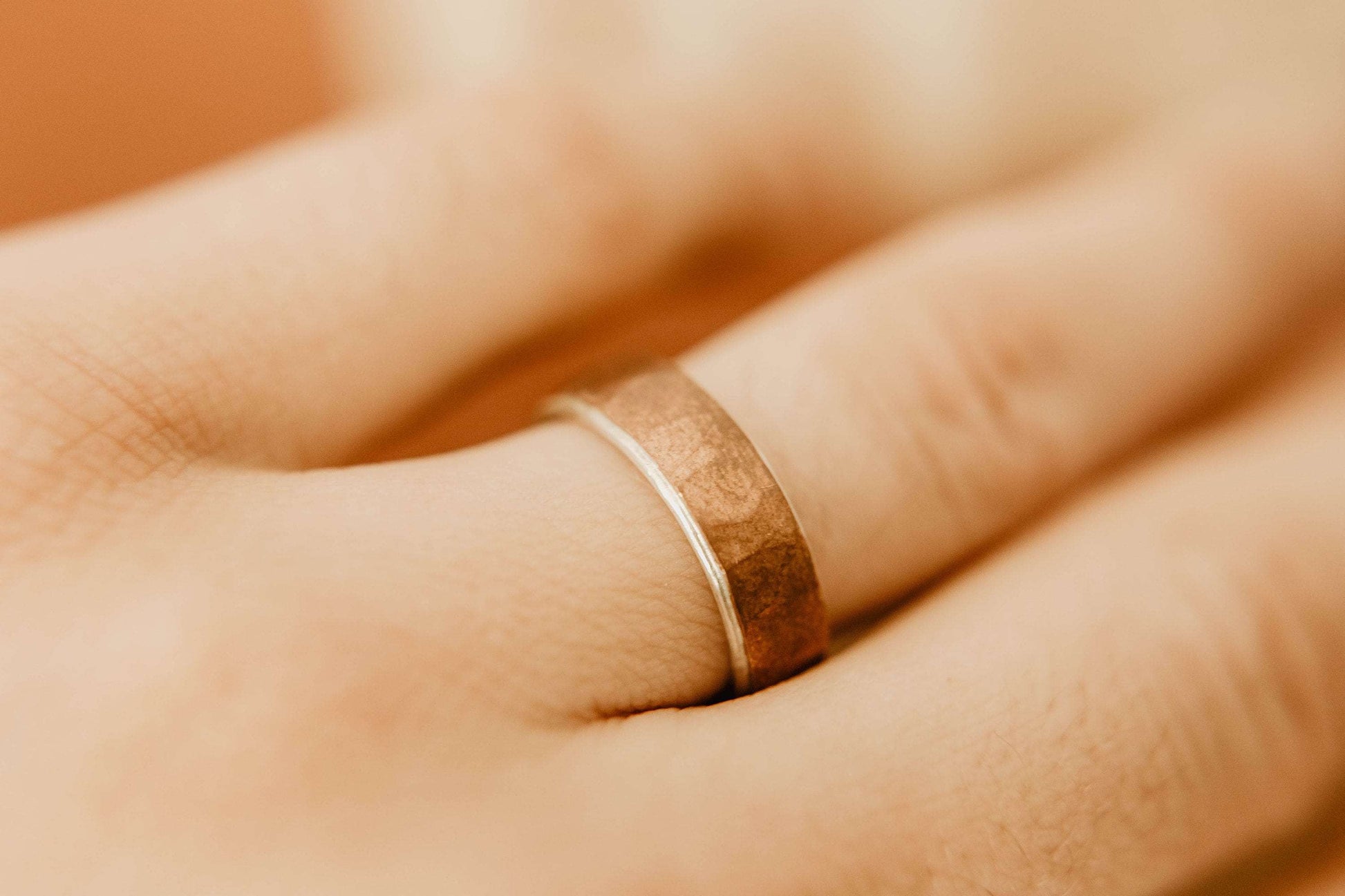 Rustic Mens Copper and Silver Wedding Band. This photo shows a ring with copper exterior and silver interior (Shown on finger)