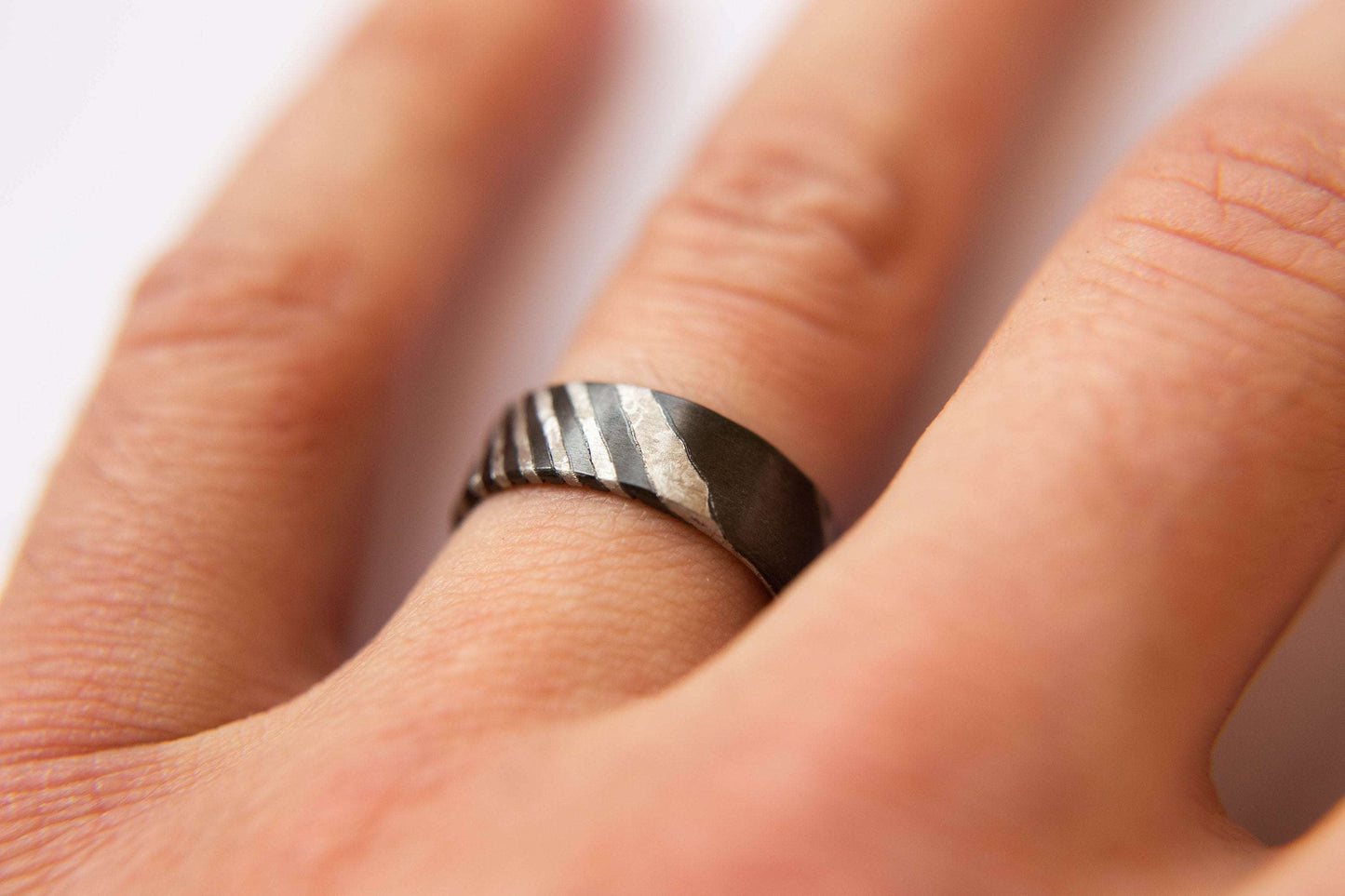 Black Zirconium and Crystallized Titanium Damascus Wedding Band. Black and Silver Ring. (Shown on finger)