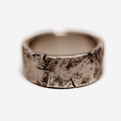 Handmade Tungsten Wedding Band. This photo shows a battle worn, scratched, and gashed 10mm tungsten ring. (Horizontal with white background)