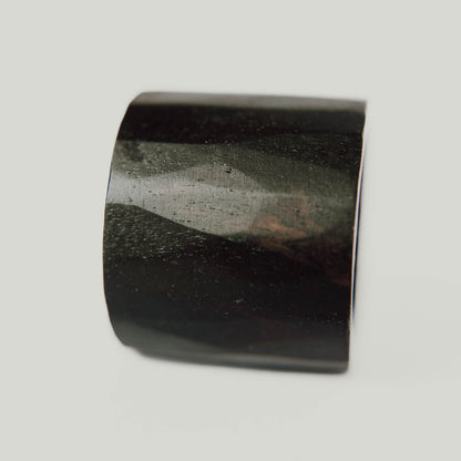 African Blackwood Ring, Dark lightly faceted wide wood ring. (Vertical with white background)